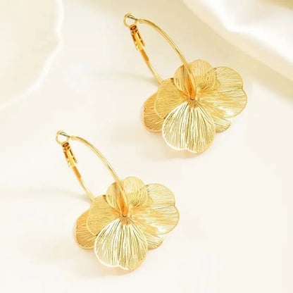 Pendientes flor dorada